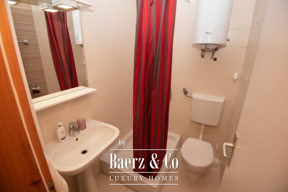 Tisno, exclusive seafront apartment house with panoramic sea views and a boat image