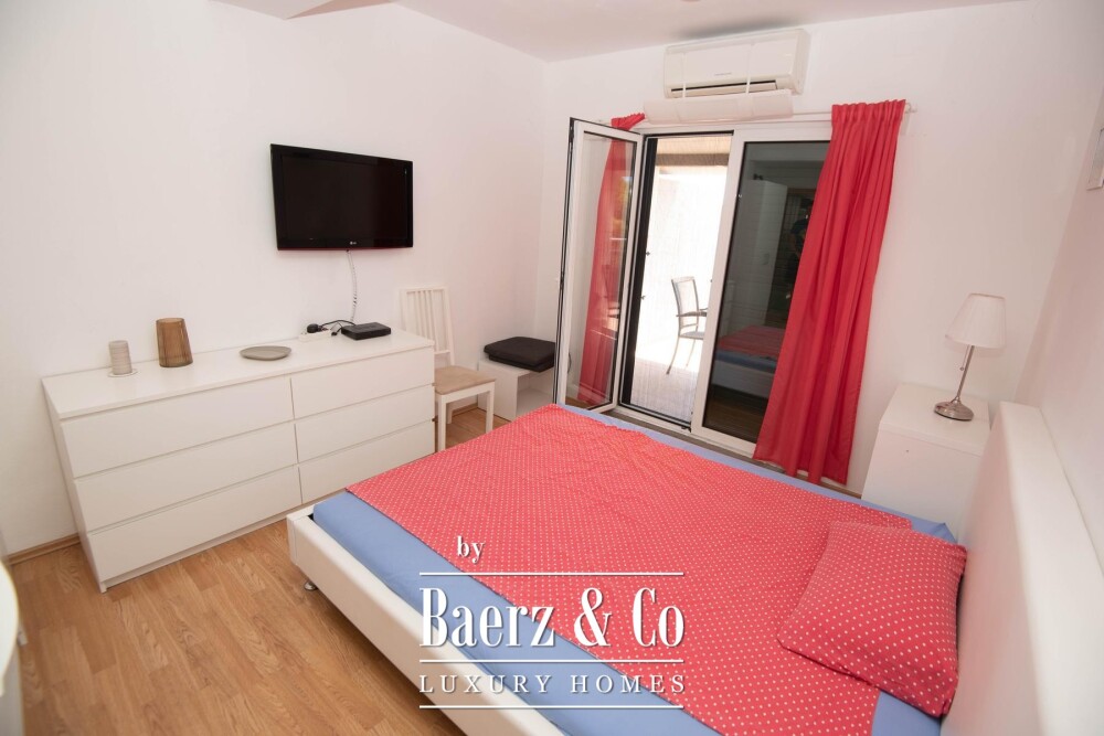 Tisno, exclusive seafront apartment house with panoramic sea views and a boat image