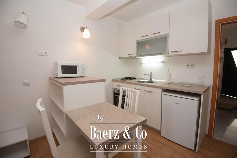 Tisno, exclusive seafront apartment house with panoramic sea views and a boat image