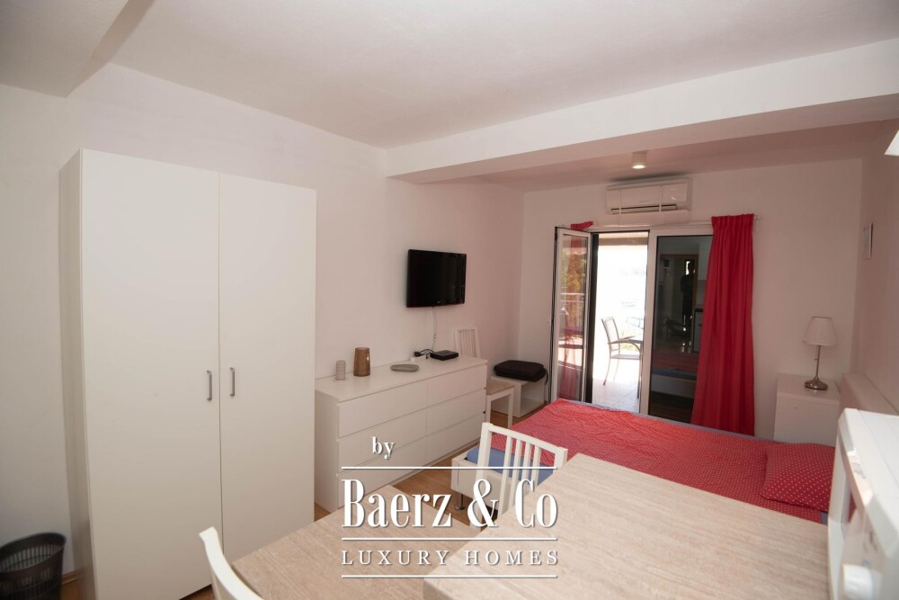 Tisno, exclusive seafront apartment house with panoramic sea views and a boat image