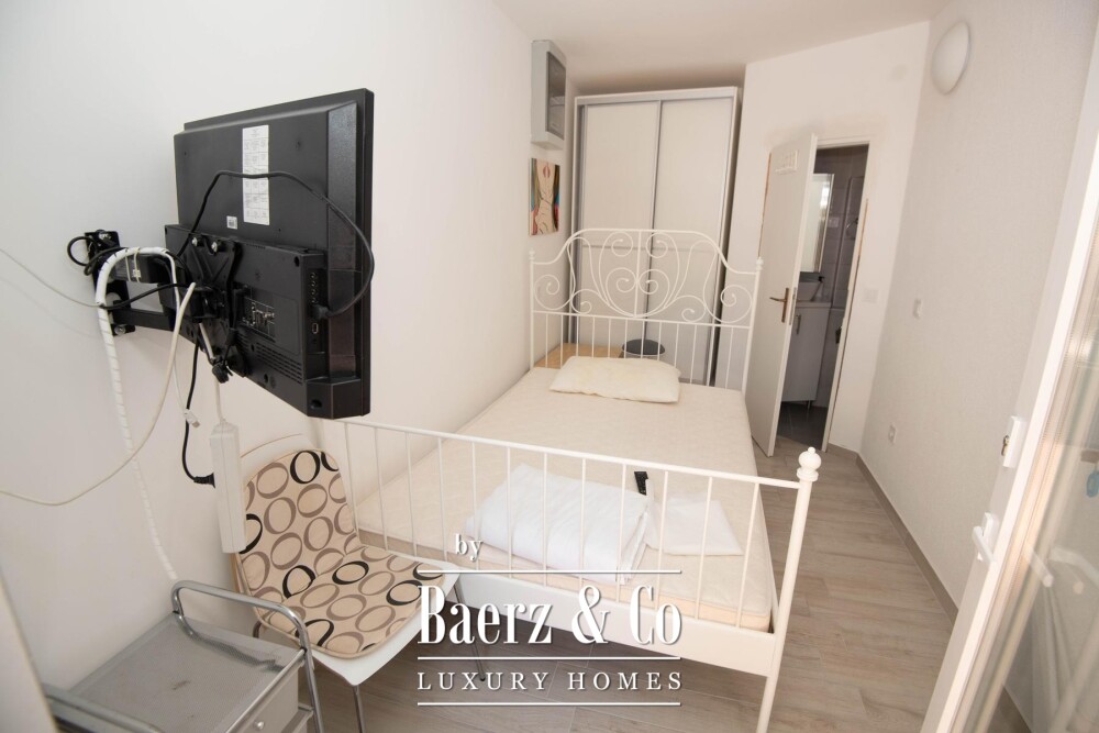 Tisno, exclusive seafront apartment house with panoramic sea views and a boat image