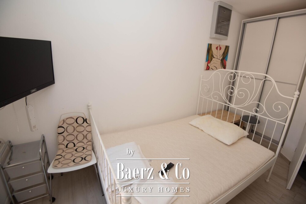 Tisno, exclusive seafront apartment house with panoramic sea views and a boat image